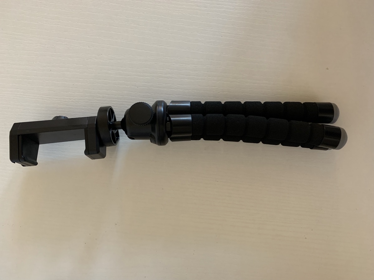 Flexible phone stand with bendy tripod legs